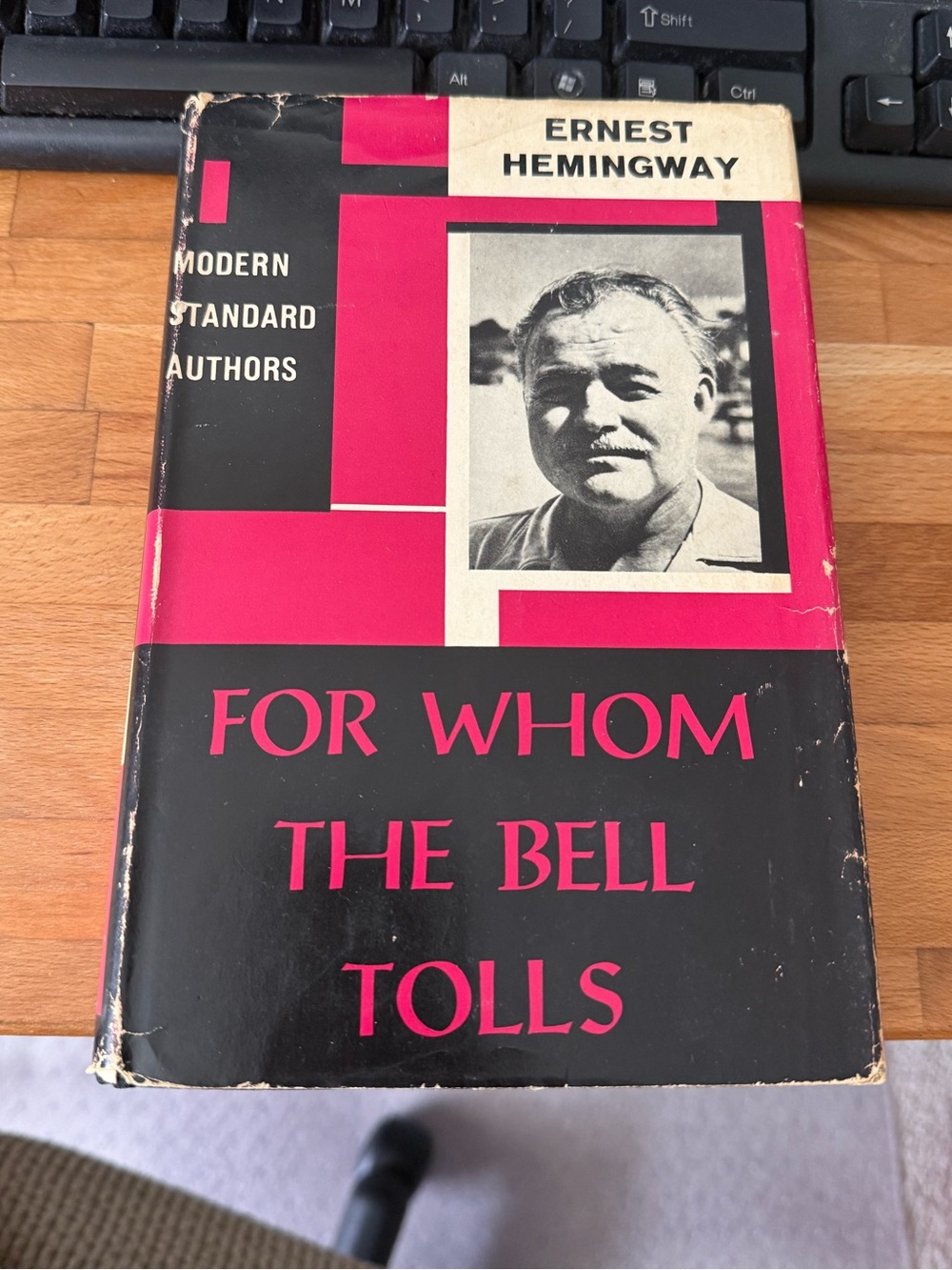 "For Whom The Bells Toll" by Ernest Hemingway, published in 1940 by Charles